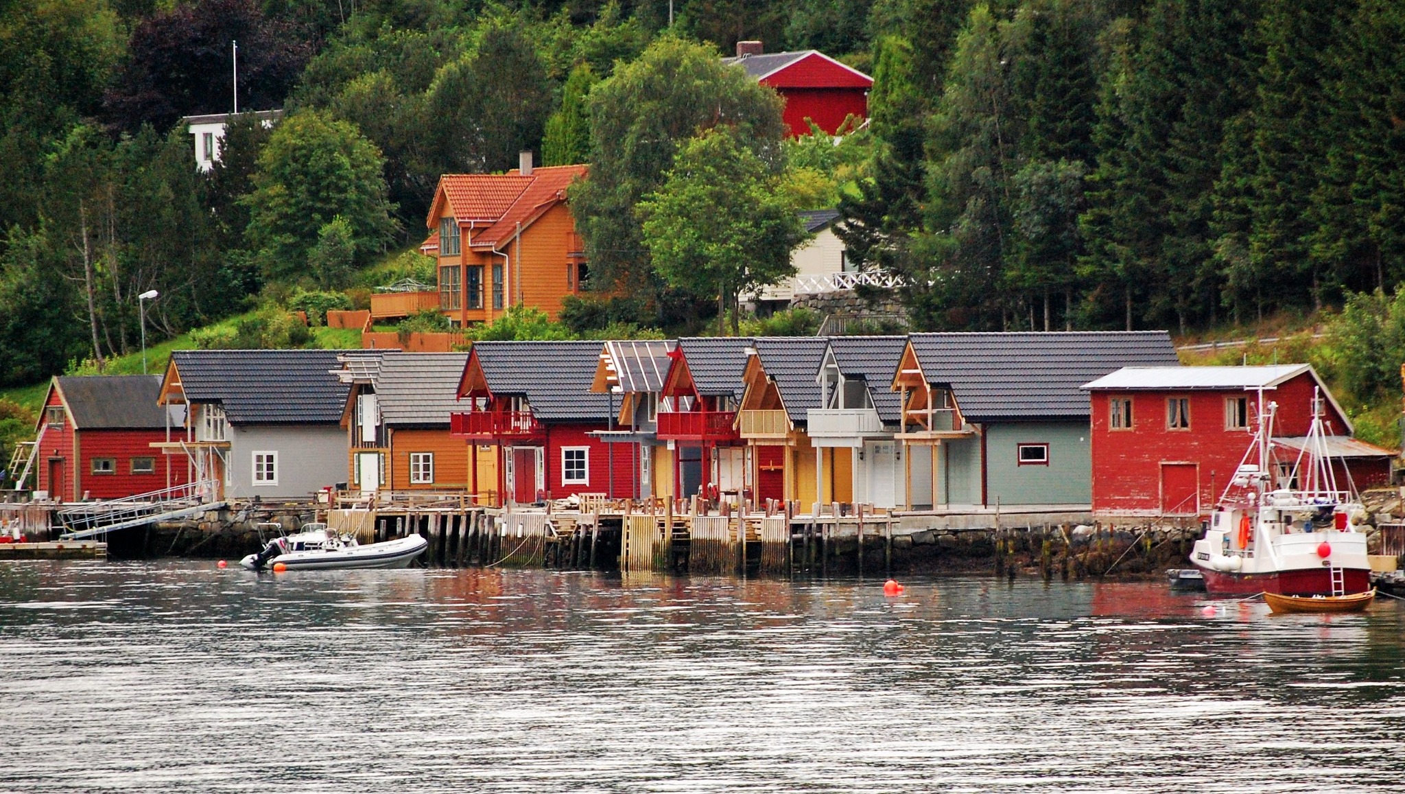 Colorful homes and boats beside a Norwegian fjord